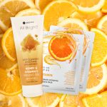 Bottle of cosmetic product on citrus fruits background